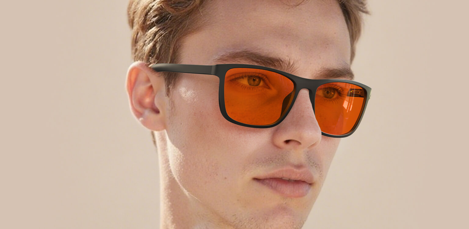 Right side view of man wearing Night Ease™ Wayfarer Orange Sleep Glasses