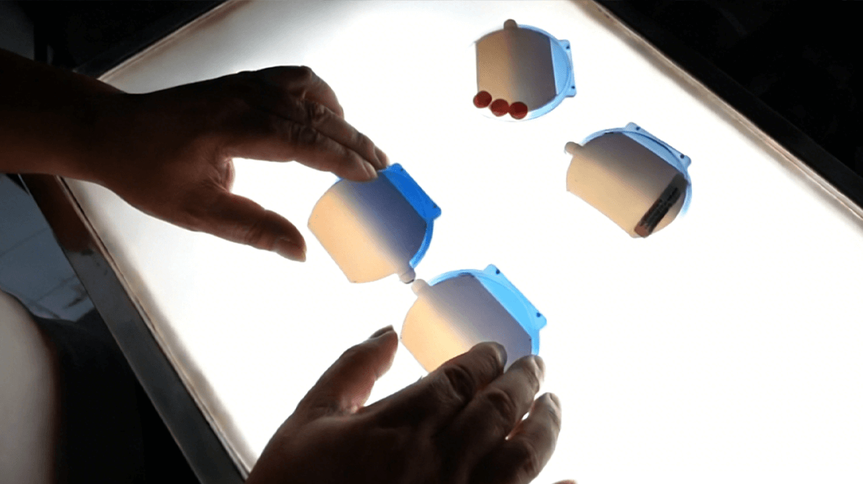 1-4-Detailed inspection of lens light transmission and tint consistency using professional light boxes