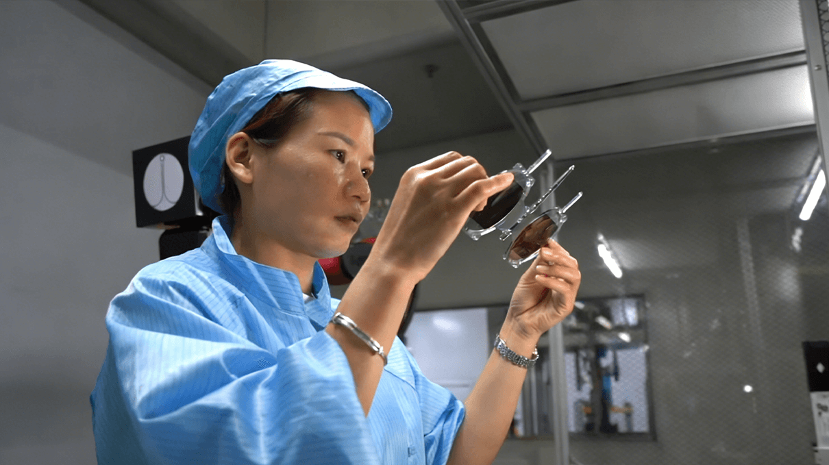 1-5-Quality assurance specialist performing a manual visual inspection of Gloojo sleep glasses lenses