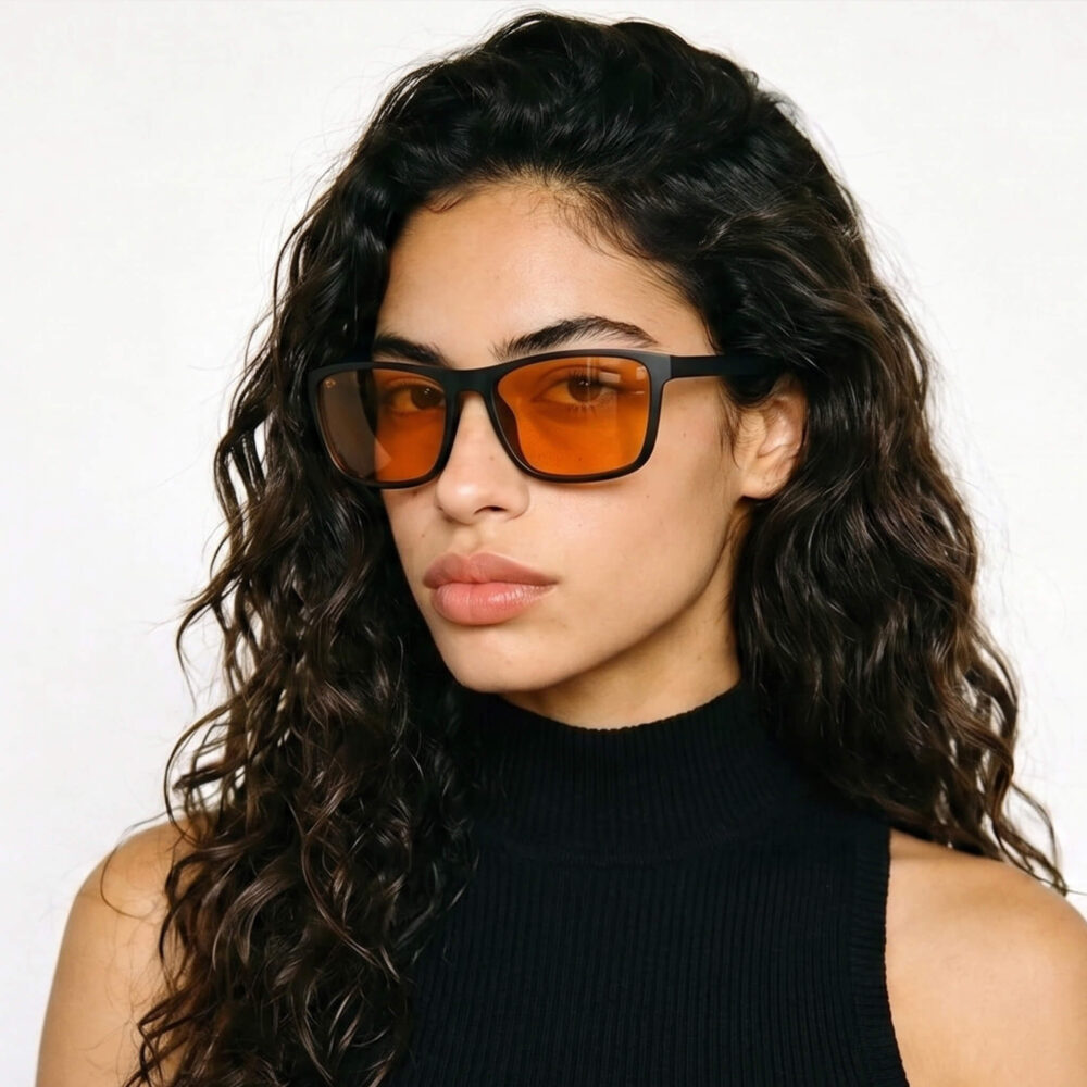 168-Female model wearing Gloojo Night Ease orange lenses for sleep optimization