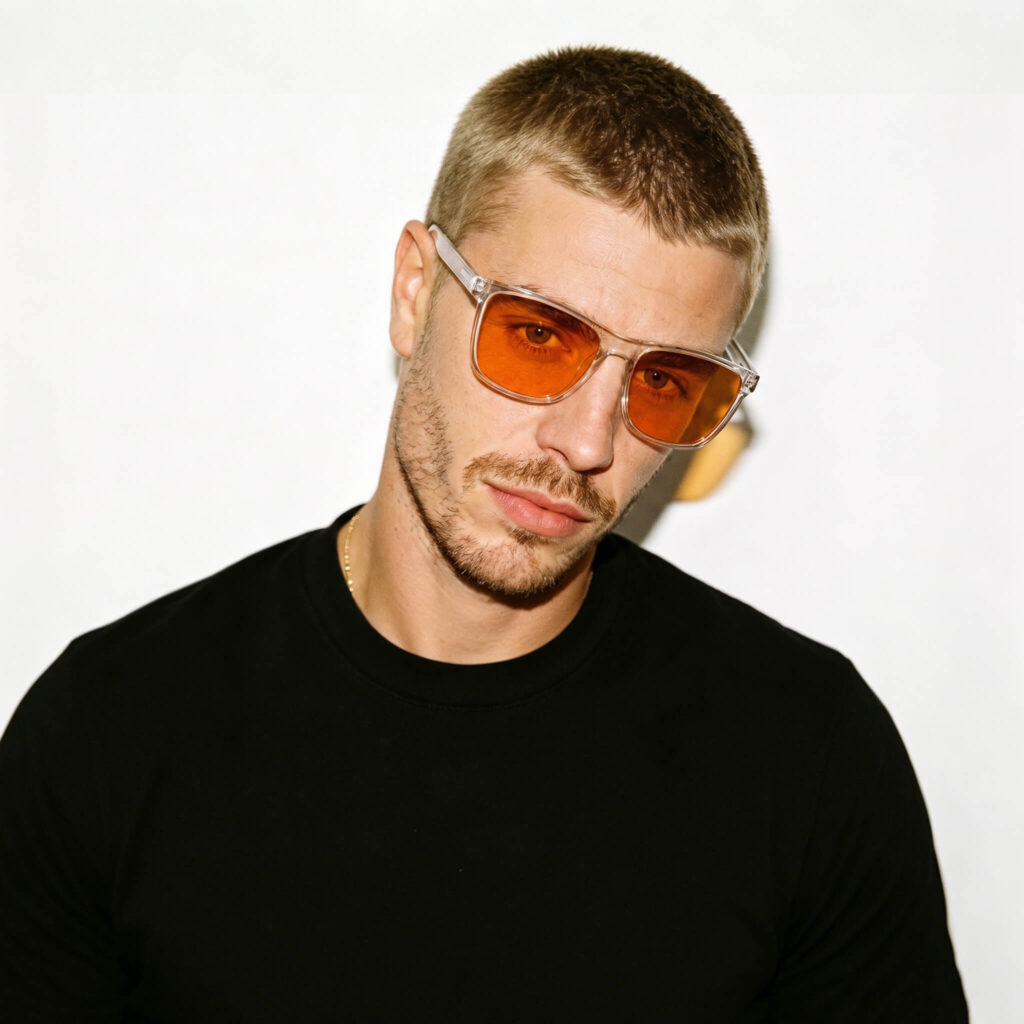 168-Male model wearing Gloojo Night Ease sleep glasses with orange lenses