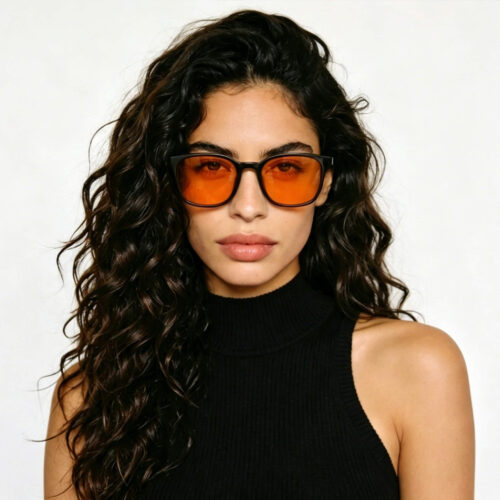 266-Female model showcasing Gloojo Night Ease orange-lens glasses designed for circadian health